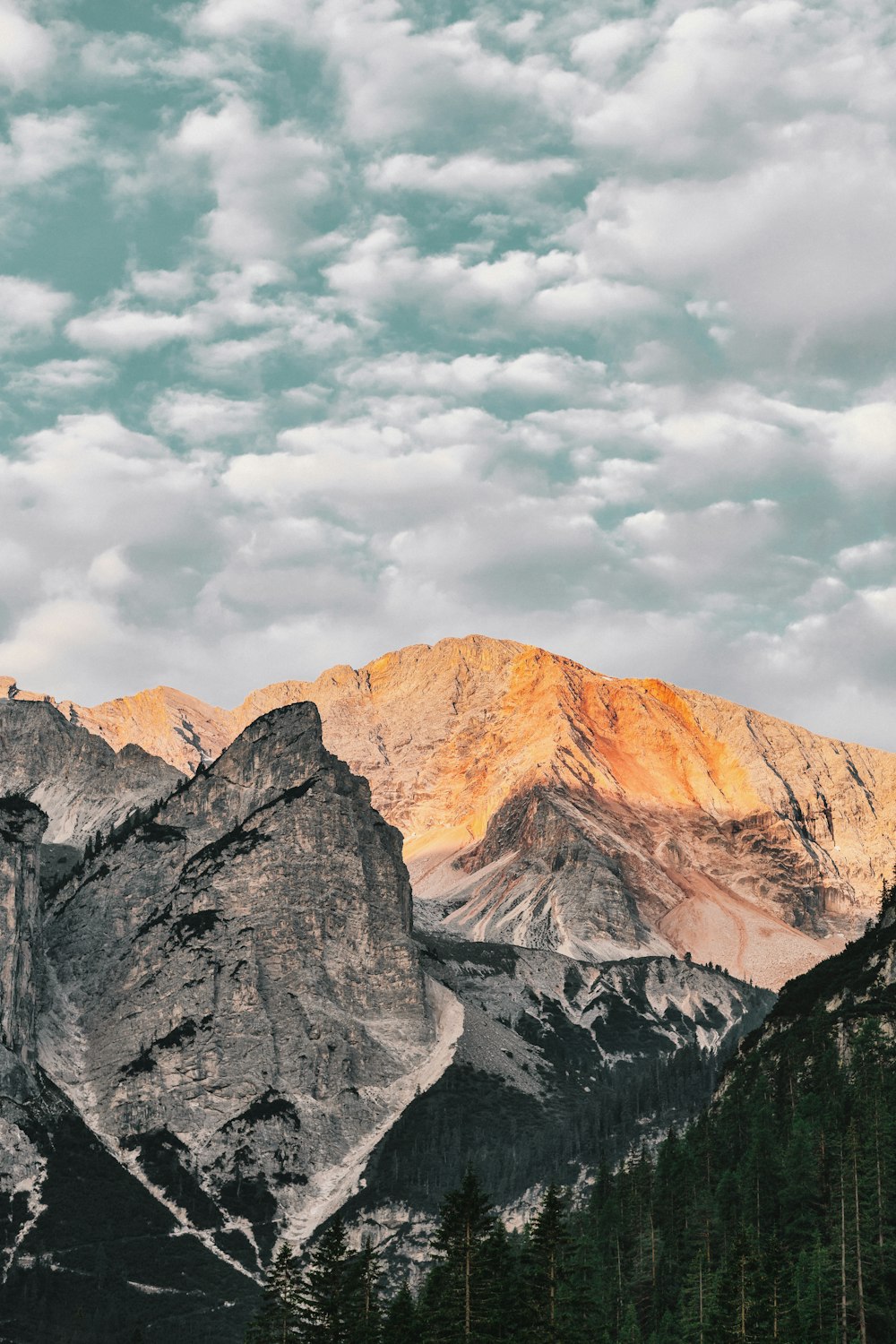 mountain under white clouds at daytime