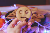 Smiling community members gathered around a table with fresh cookies.