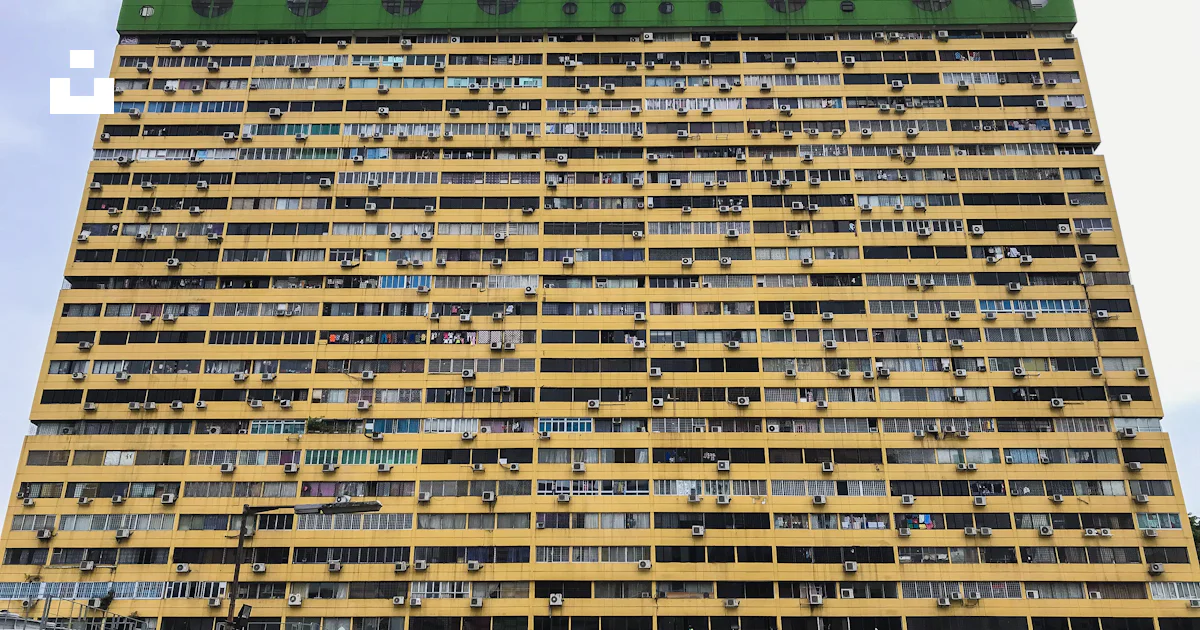 Photo of green and yellow buildings photo – Free Building Image on Unsplash
