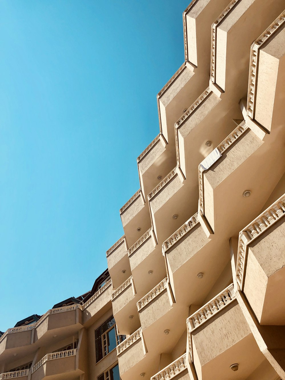 brown concrete building during clear sky