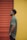 man in gray t-shirt standing near red roll up door