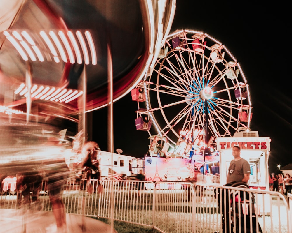 people riding on ferris wheel