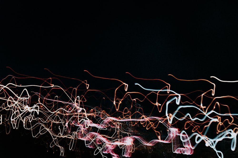 a blurry photo of a clock tower at night