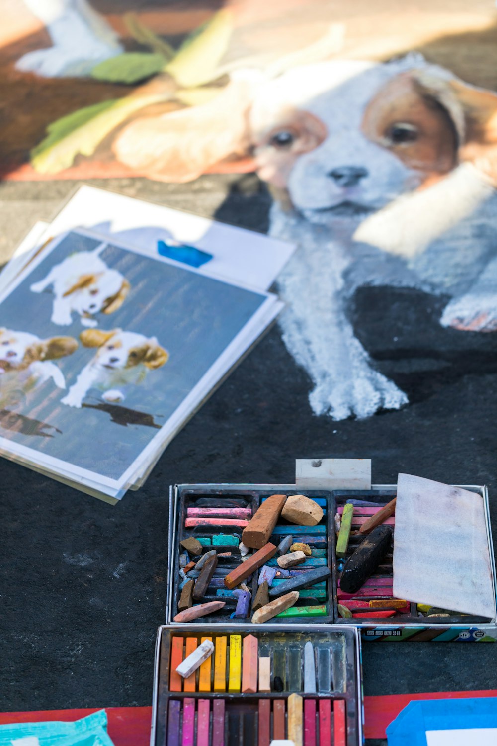 drawing of puppies beside coloring materials