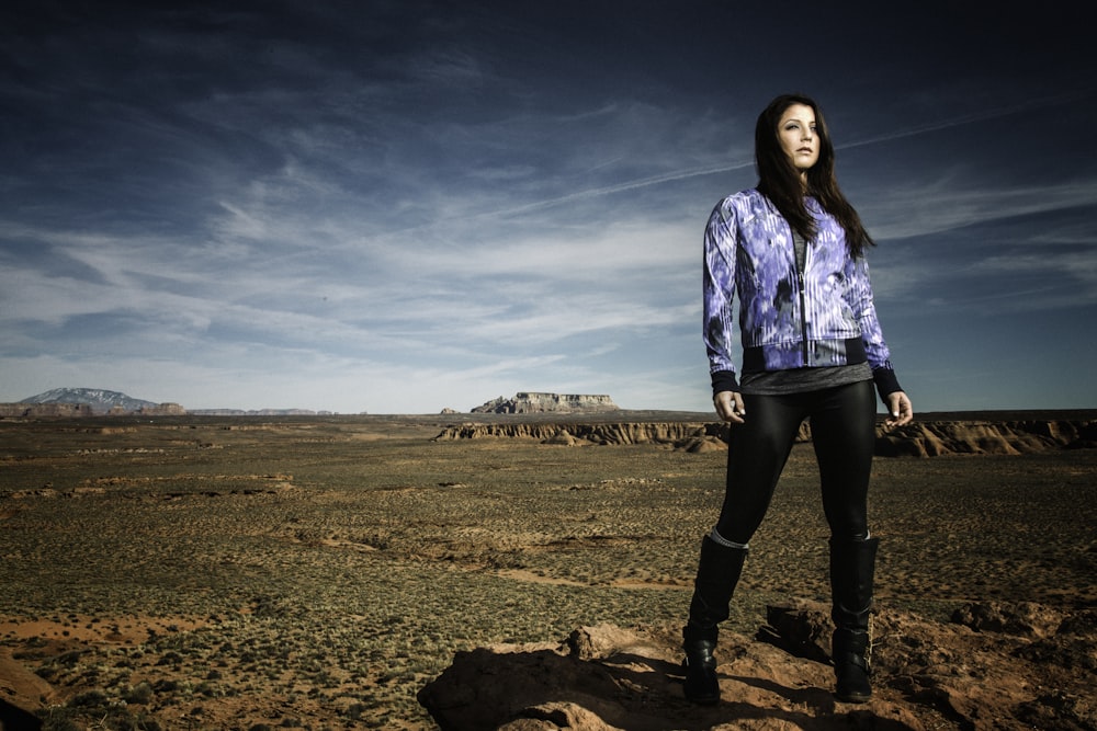 woman standing on brown soil