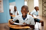 boy holding white paper