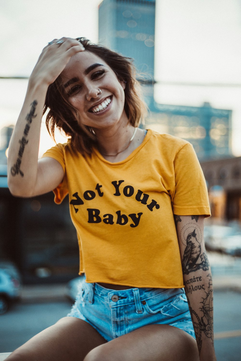 woman wearing yellow shirt and short shorts