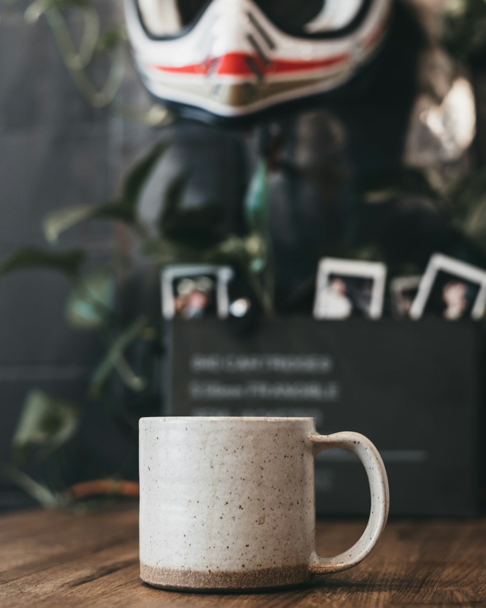 beige and gray mug on brown tabletop