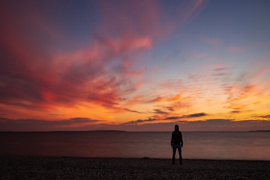 silhouette of man standing in Limfjord Denmark