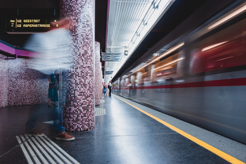 two person standing in front of train railway