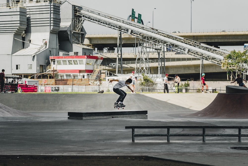 man skateboarding on gray concrete ramp