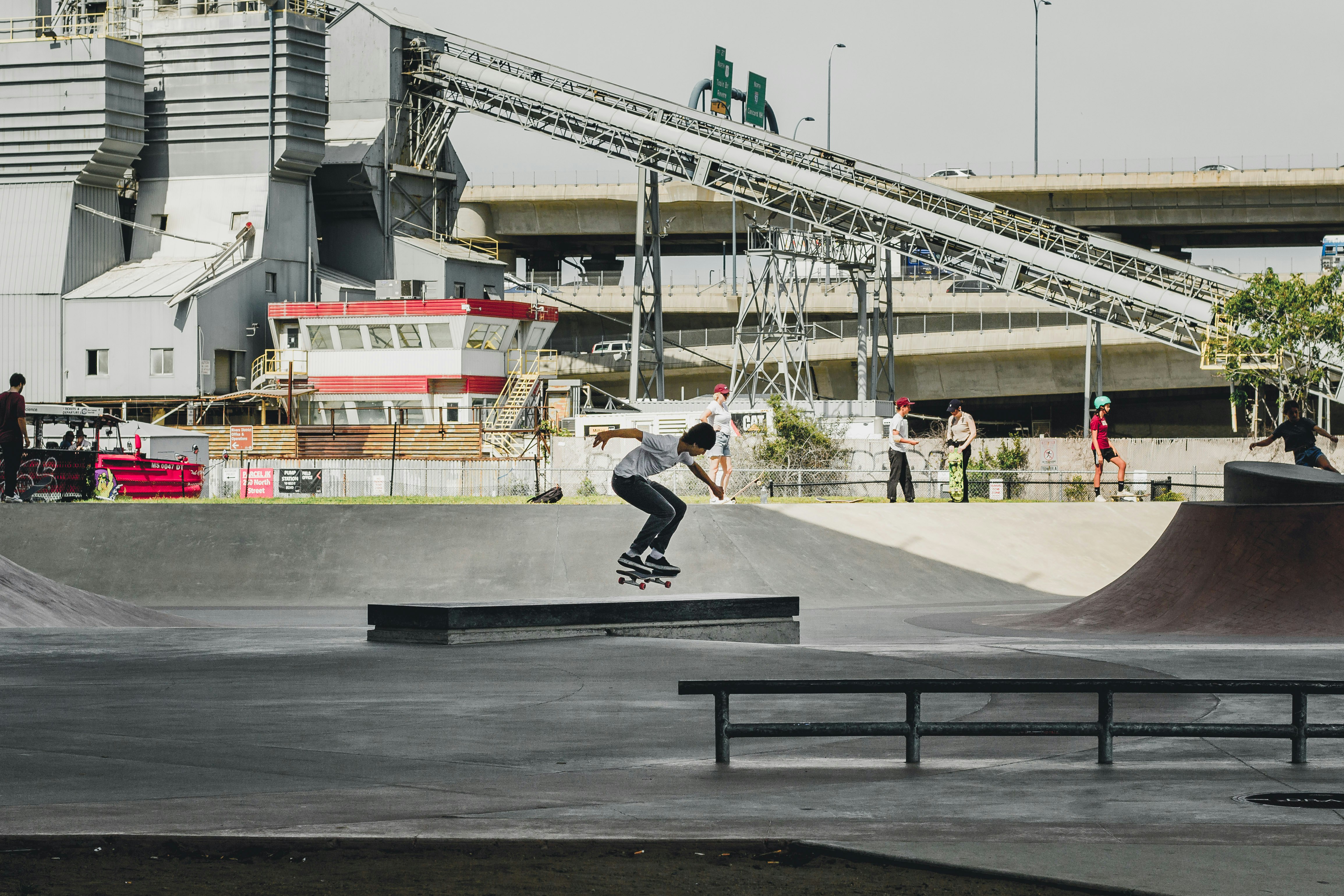 man skateboarding on gray concrete ramp