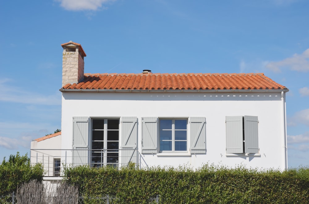 white and orange painted house