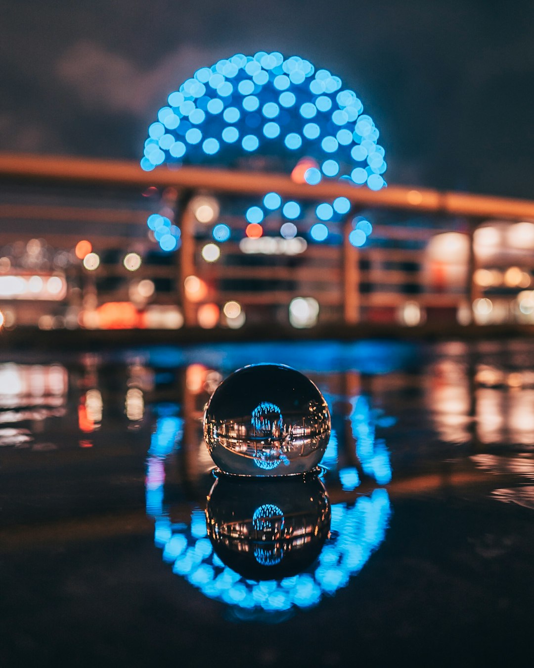 selective focus photography of waterball with ball monument