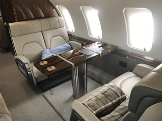 Elegant interior of a midsize jet with plush leather seats.