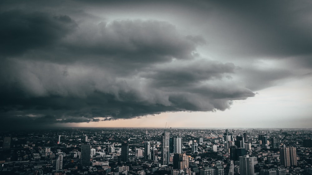 cumulonimbus clouds over city buildings