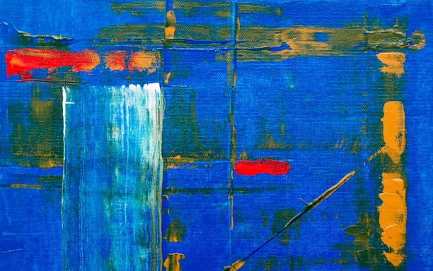 An abstract painting featuring a vibrant blue background with dynamic strokes of orange and red. Vertical and horizontal lines intersect across the canvas, adding structure and depth. A splash of white creates a focal point, contrasted by the bold colors around it.