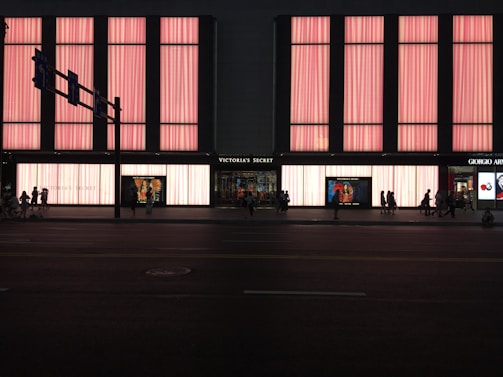 A curated selection of Victoria's Secret products arranged artfully with soft lighting.