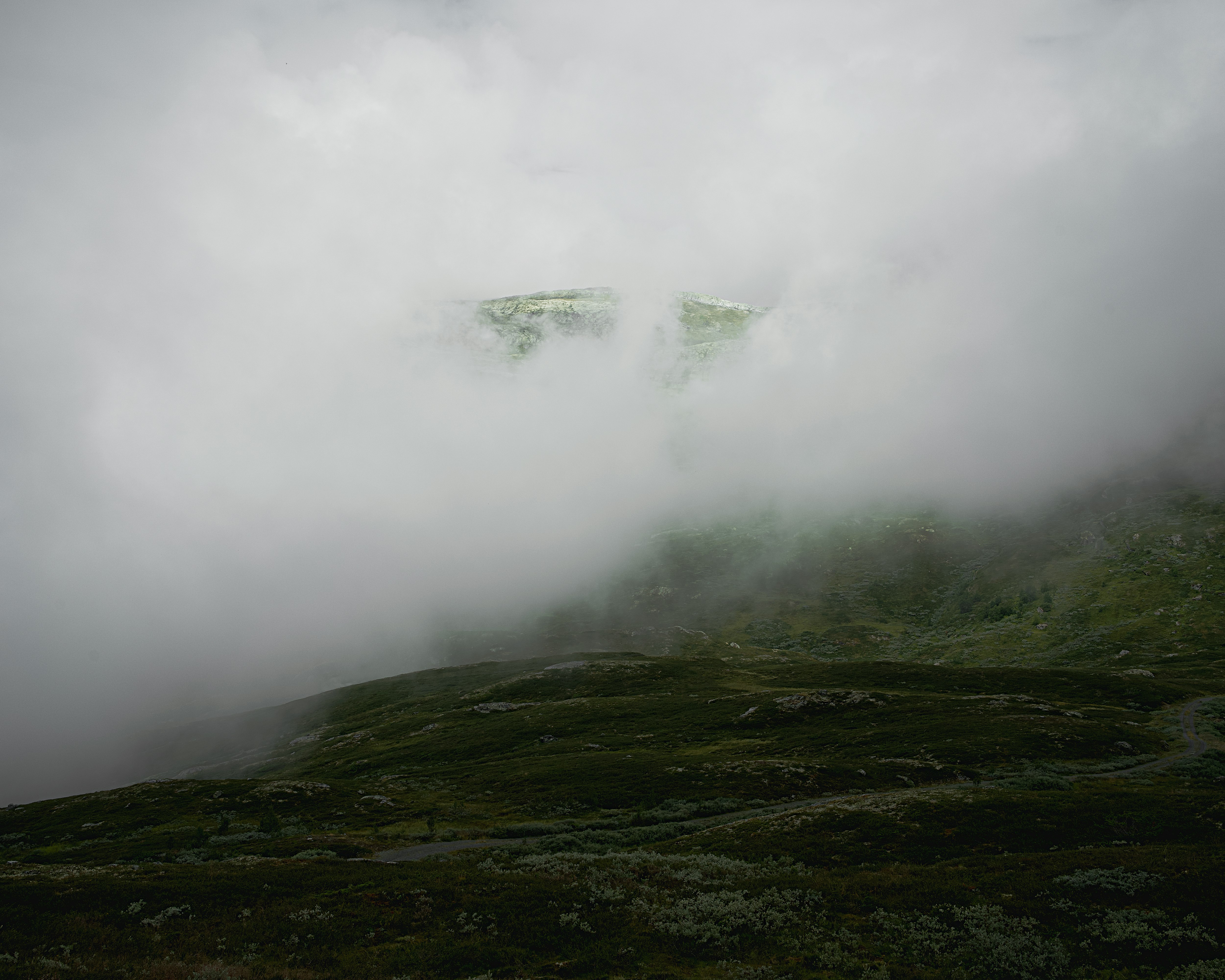 fogged mountain during daytime