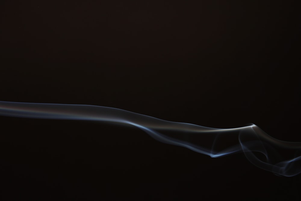 a long smoke trail on a black background