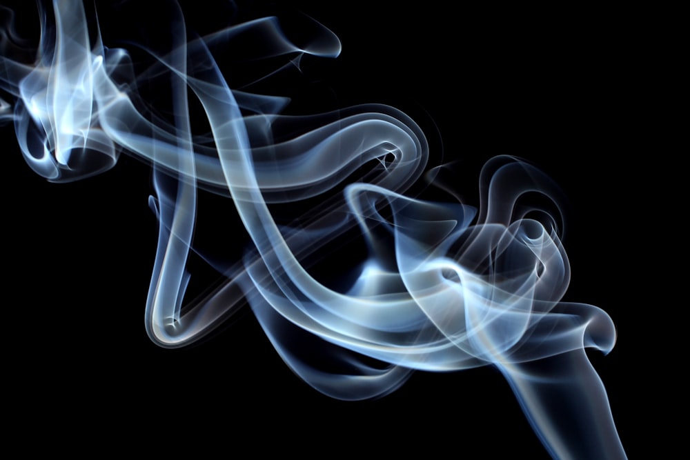 white smoke on black background