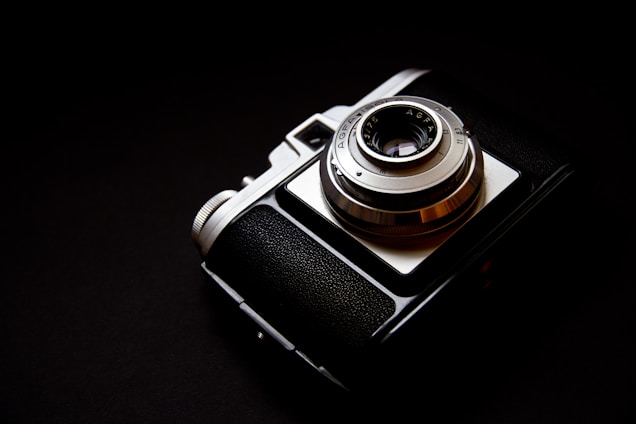 silver and black point-and-shoot camera