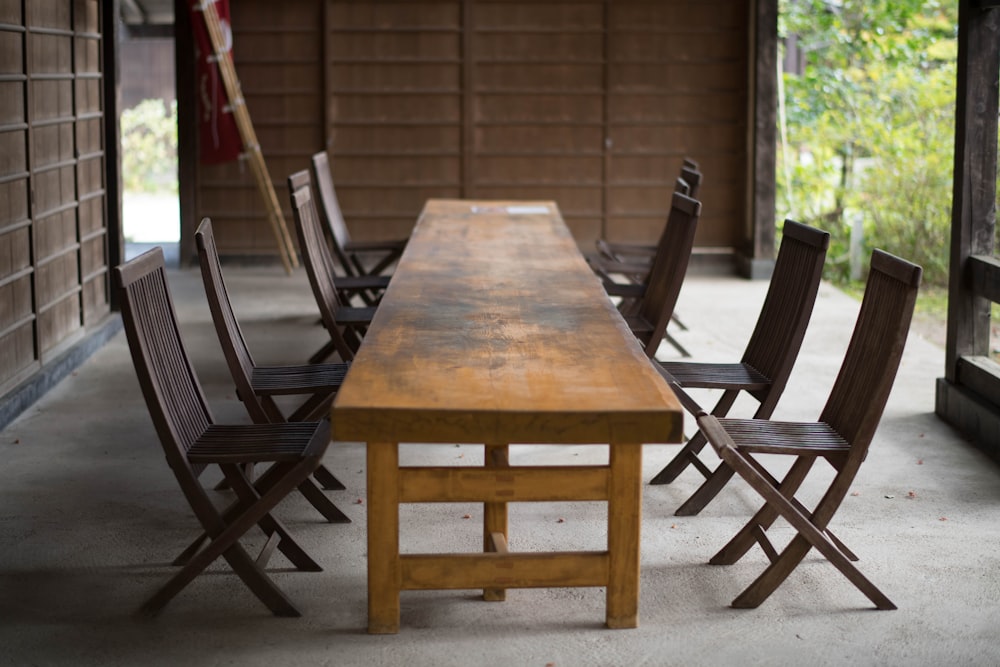 rectangular brown wooden 9-piece dining set