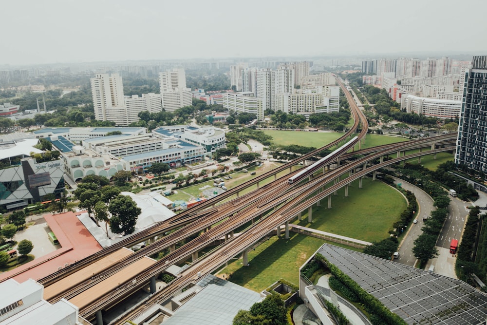 aerial photo of roads near high-rise buildings