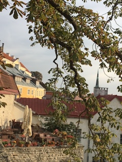 A cozy outdoor café in a charming European town filled with flowers.