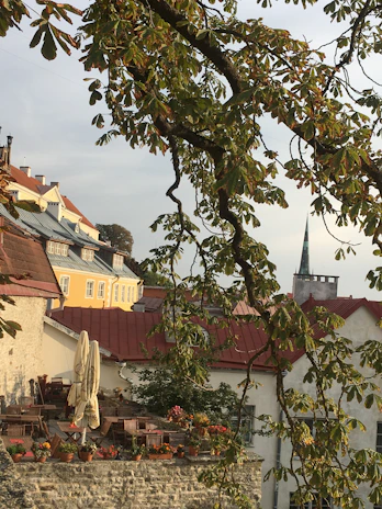 A cozy café terrace in a charming old town, perfect for relaxing after a day of travel.
