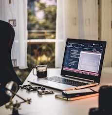 MacBook Pro on white table