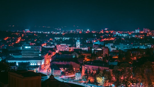high rise buildings during night time in Cluj-Napoca Romania