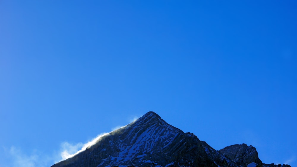 rock mountain under blue sky during daytime