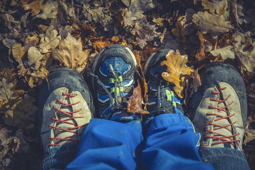 man and boy shoes on ground