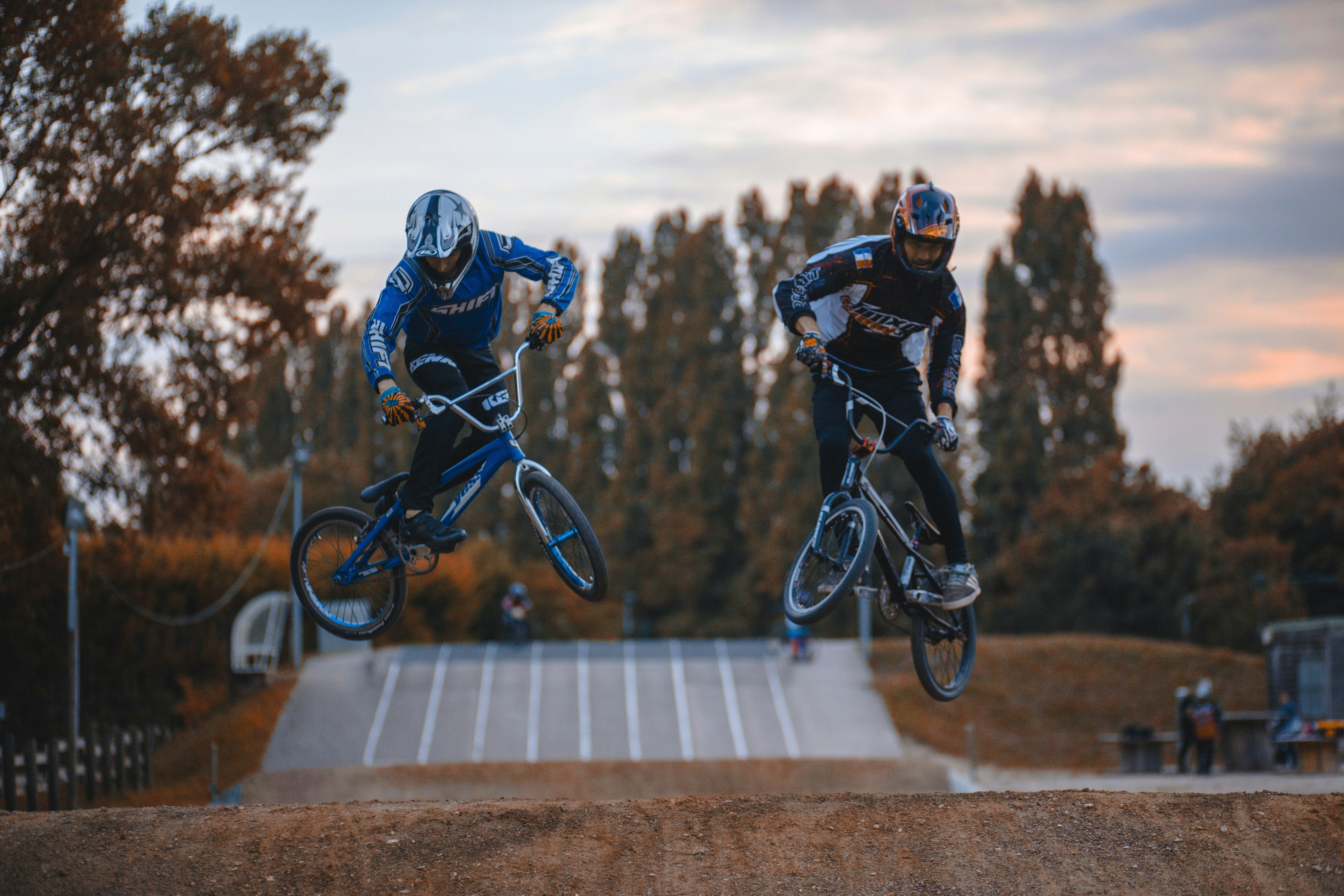 two person doing BMX tricks