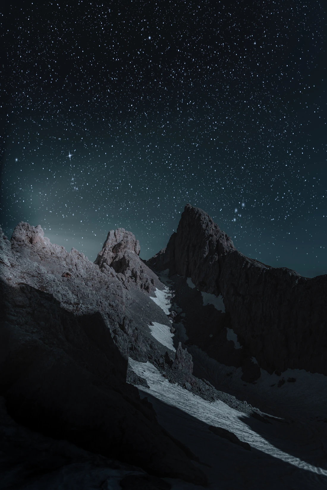 A dramatic mountain peak at twilight