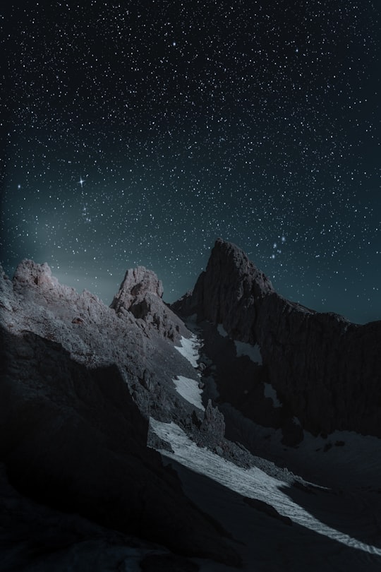 brown mountain at nighttime in Latemar Italy