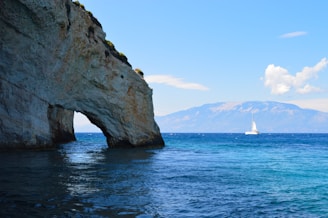 The iconic Arch of Cabo San Lucas seen from the sailboat on a clear sunny day.