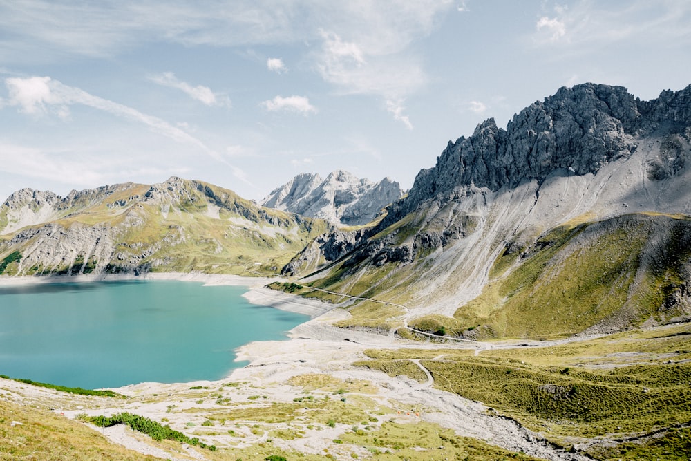 body of water surrounded by mountains