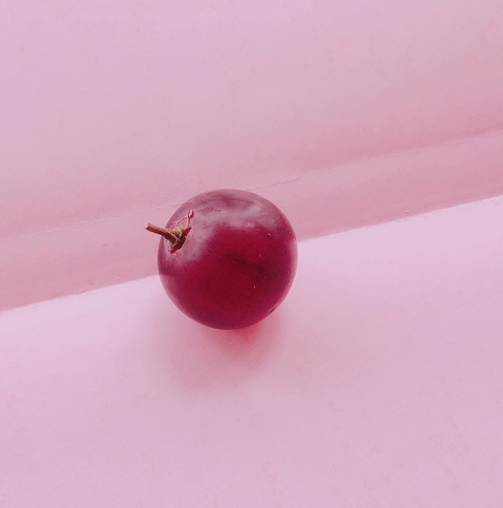 cherry fruit on pink textile