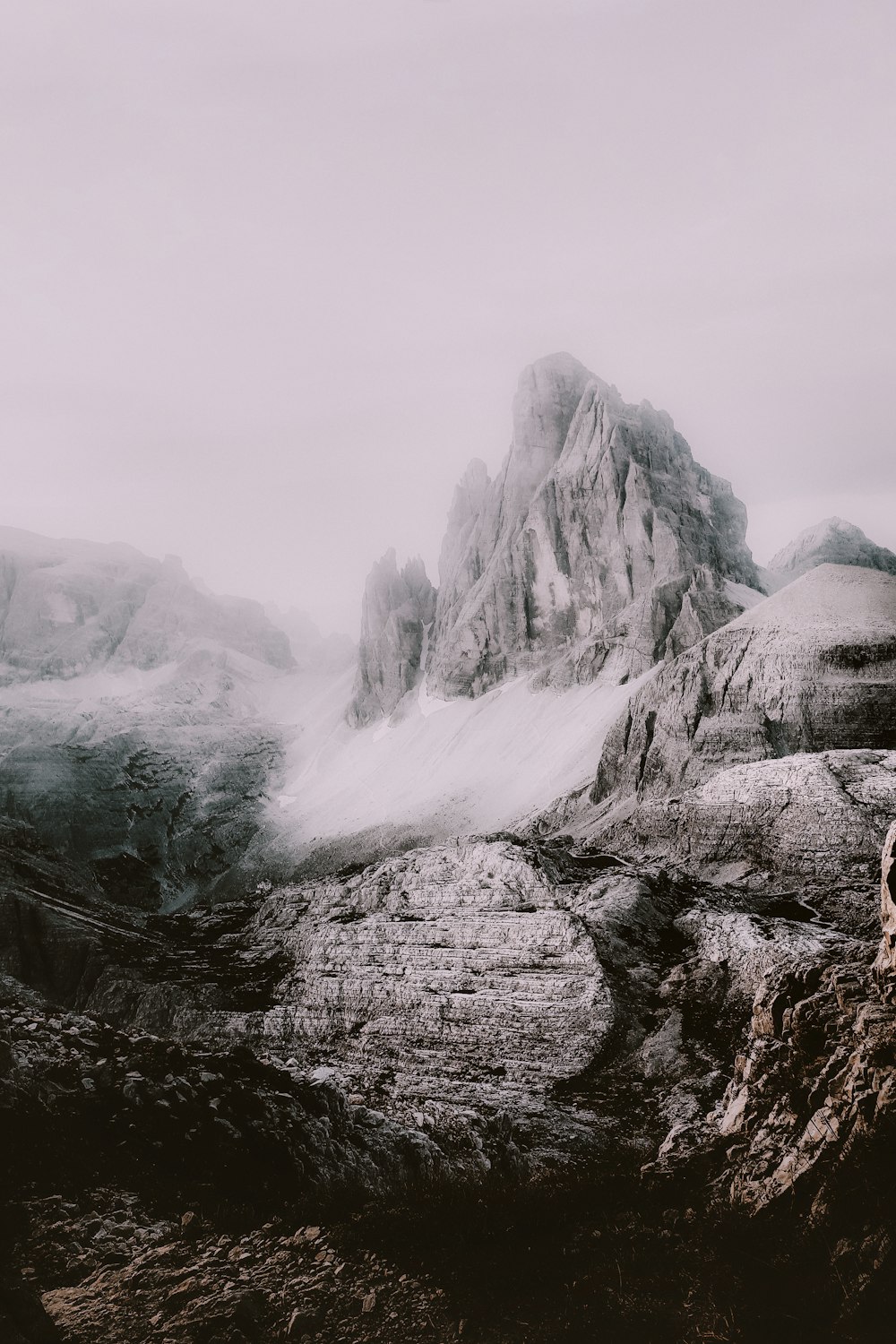 grayscale photography of rock formation