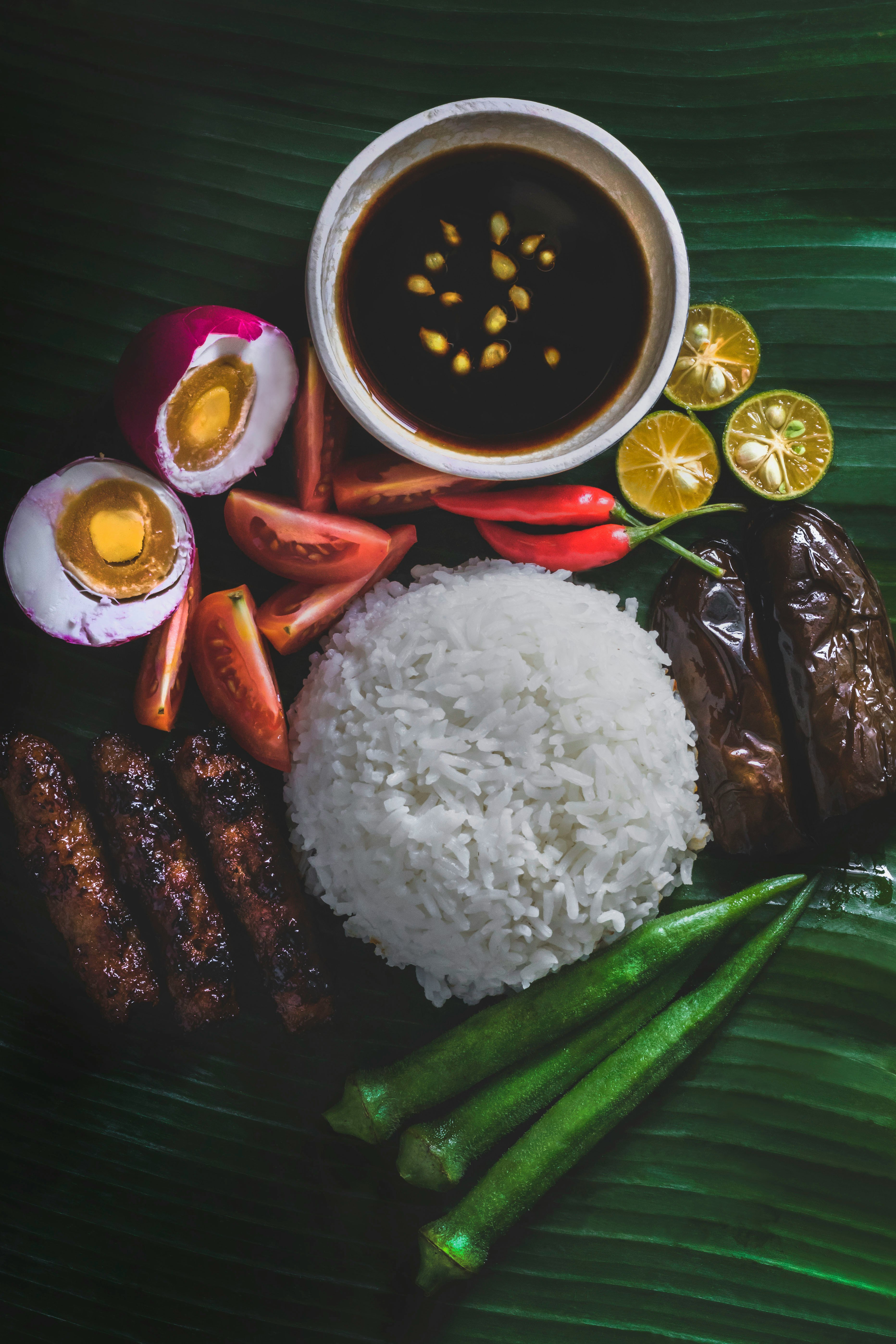 white rice, steamed okra, grilled eggplant, and salted egg