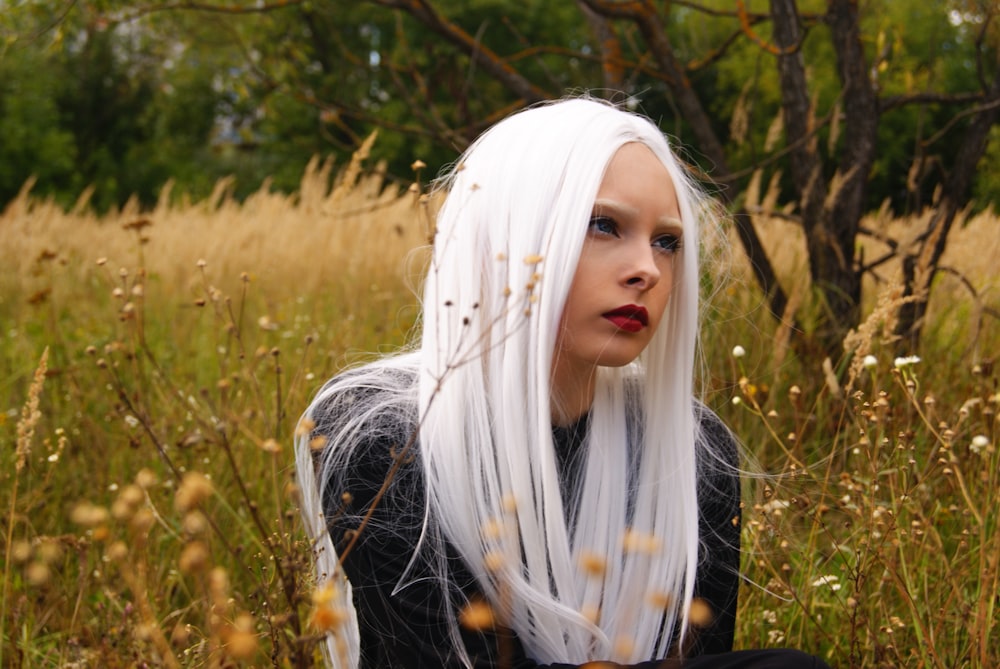 woman wearing black shirt with long white hair