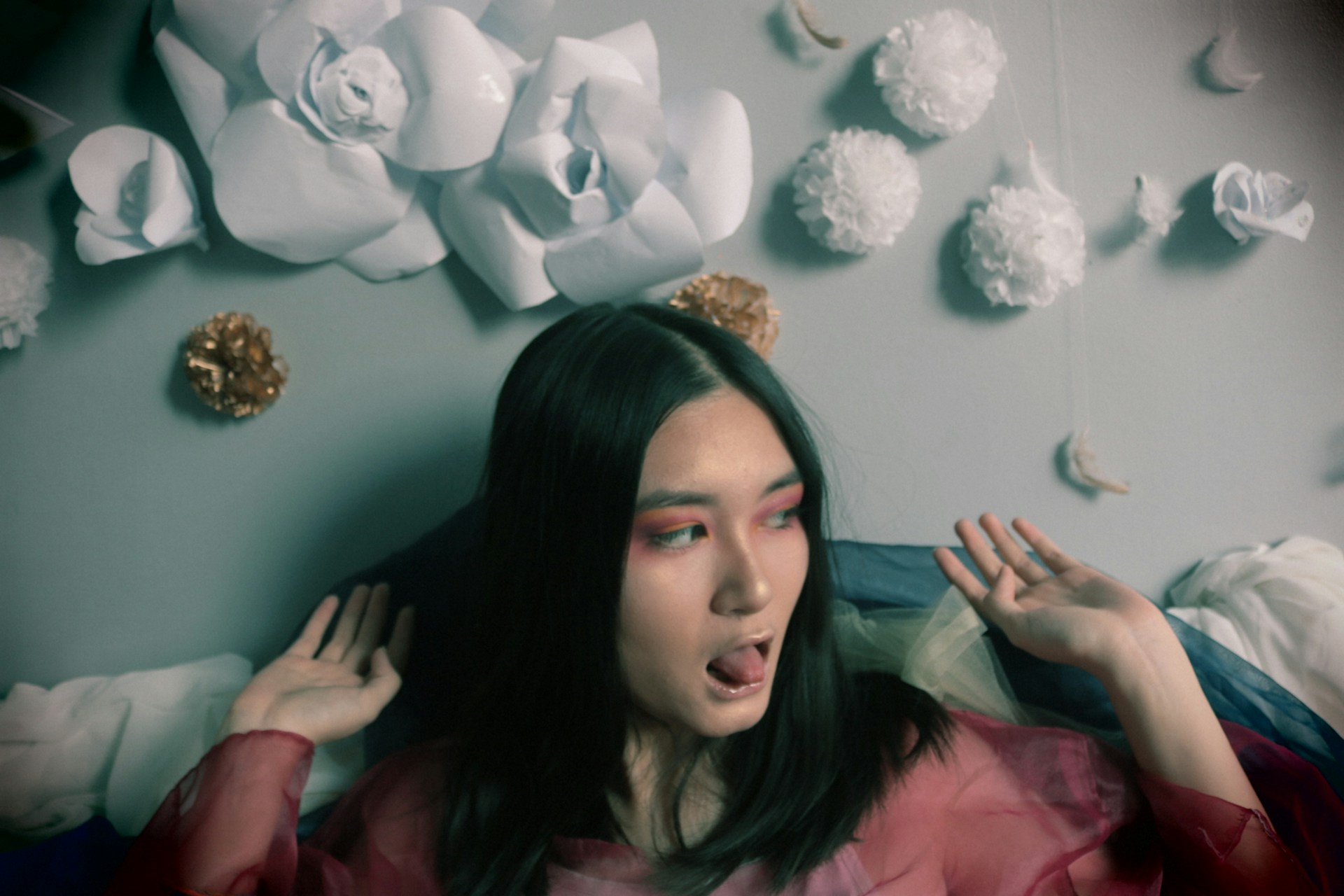 woman wearing yellow long-sleeved dress under white clouds and blue sky during daytime