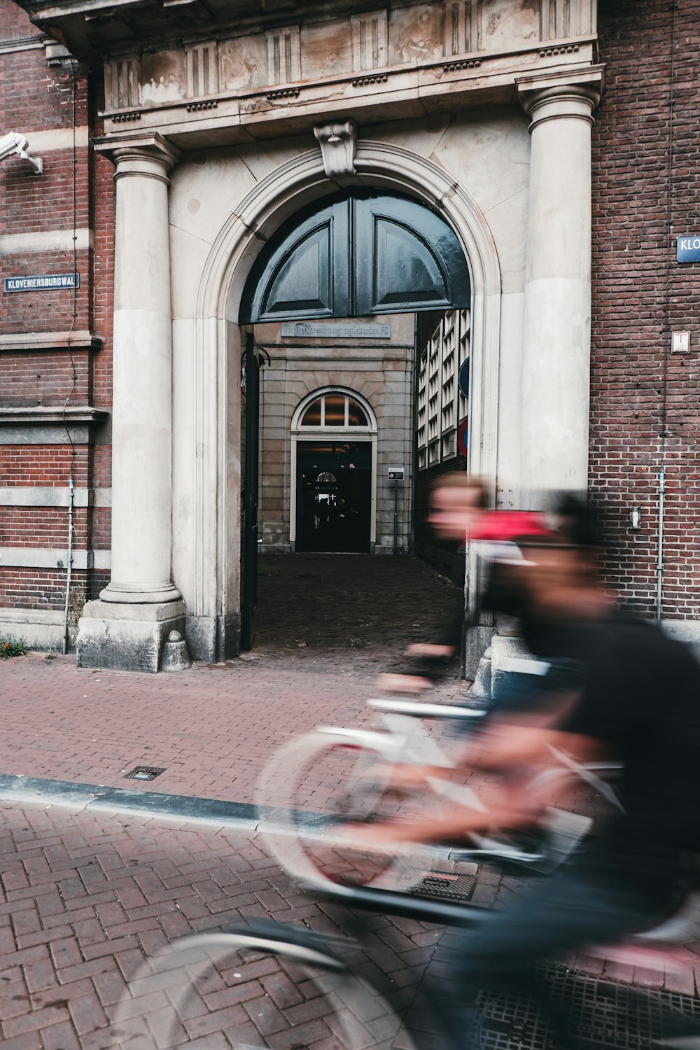 panning photography of two person riding bikes