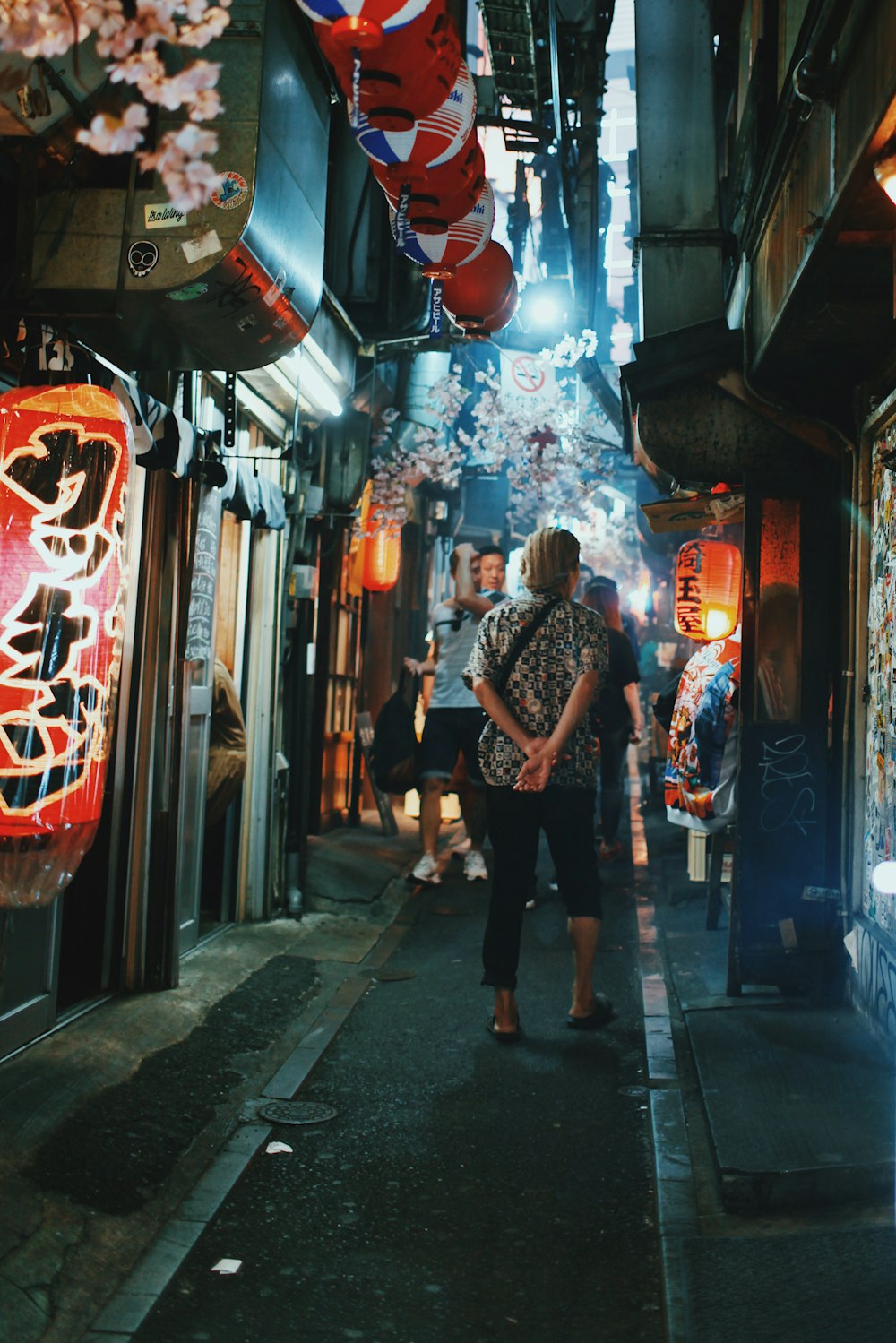 person standing on pathway at night