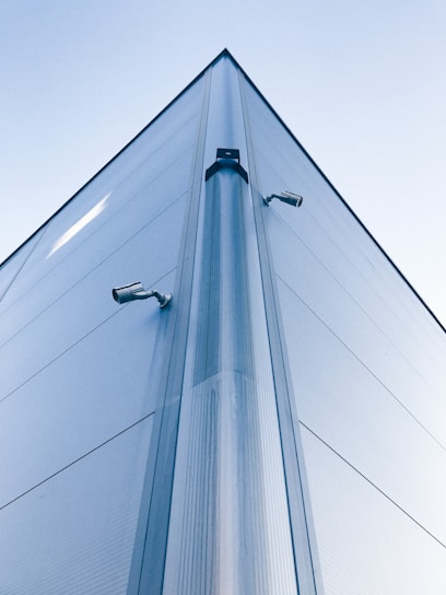 low-angle photo of building with security cameras