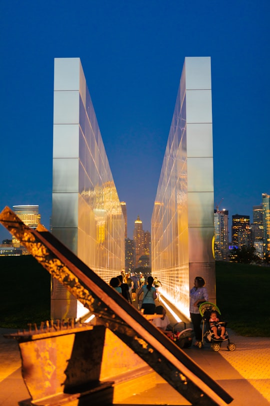 people gathering between memorial monument in Liberty State Park United States