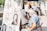 A lively event scene with an artist drawing caricatures of smiling guests.
