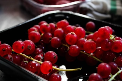 red berry on black plate